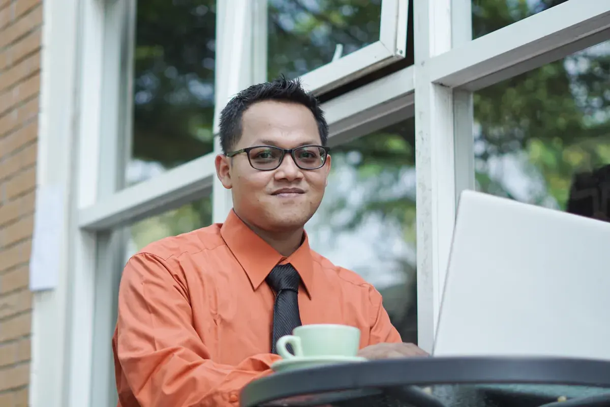 An Indonesian remote worker at their home office