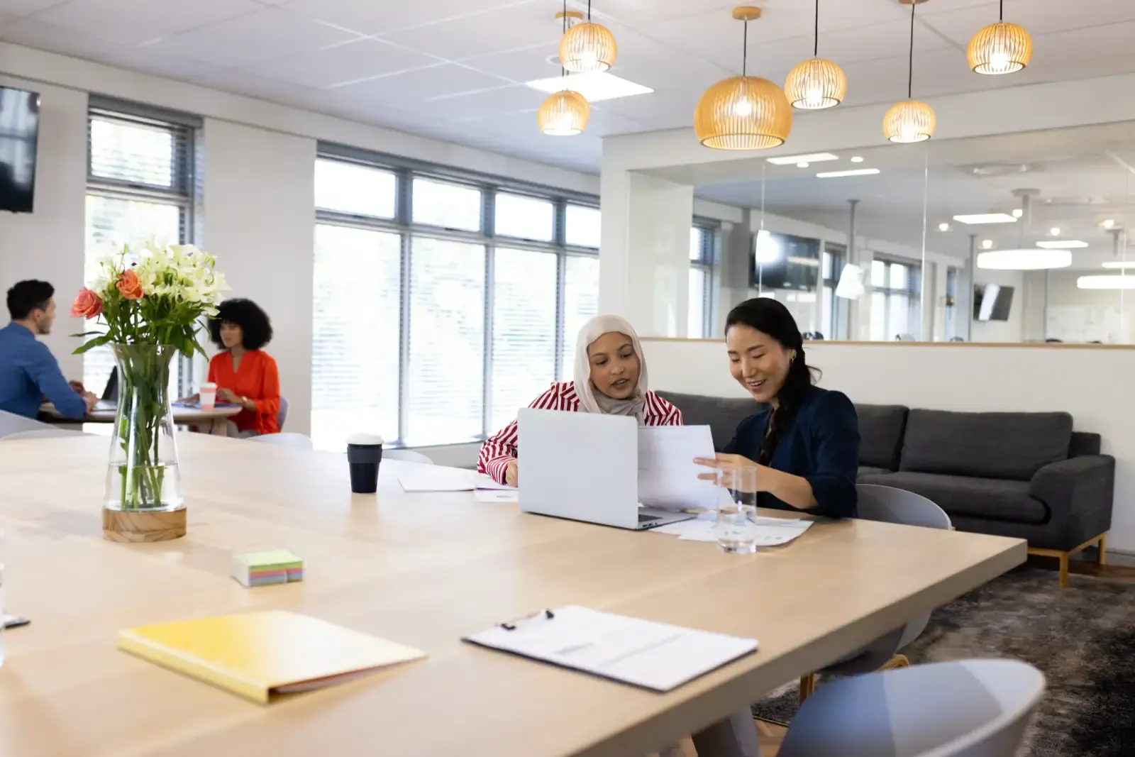 Image of diverse female colleagues working on lapt.